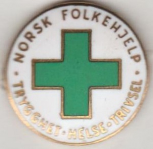Norsk Folkehjelp nål ( ligger i samlingen til Aksel Rigmund Hjelland)